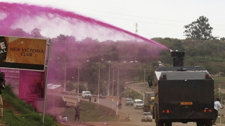 Illustration for article titled Ugandan Police Sprayed People with Pink Water Cannons to Break Up a Ceremony